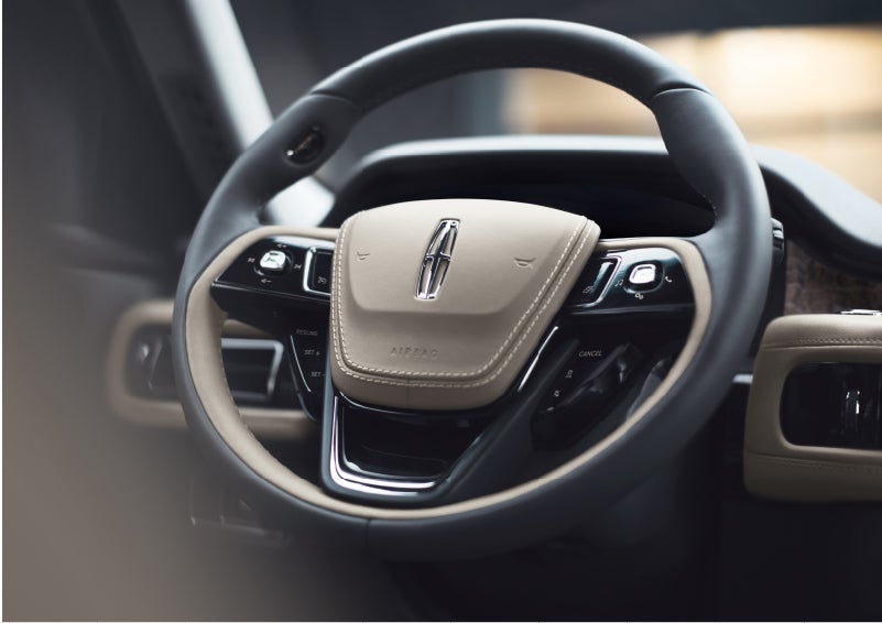The intuitively placed controls of the steering wheel on a 2023 Lincoln Aviator® SUV | Eby Lincoln in Goshen IN