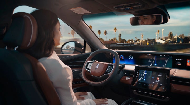A person is shown driving hands-free on the highway with available Lincoln BlueCruise technology. | Eby Lincoln in Goshen IN